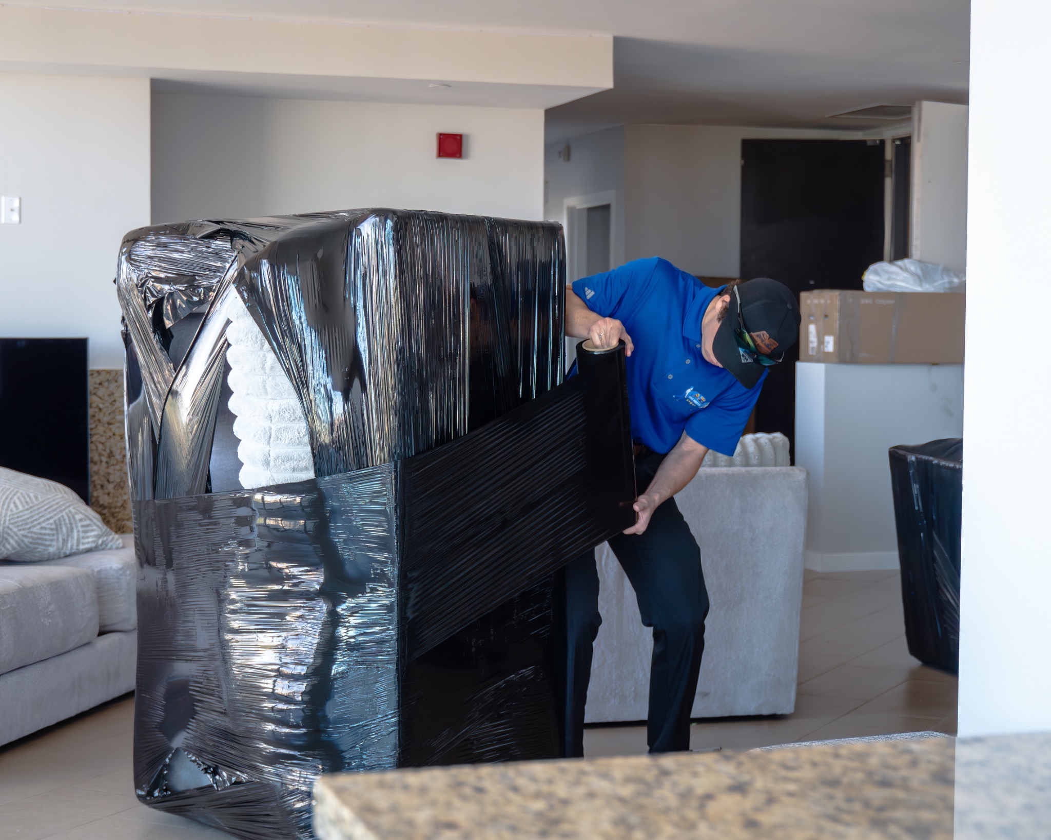 AZ Move Masters professional movers carefully wrapping furniture